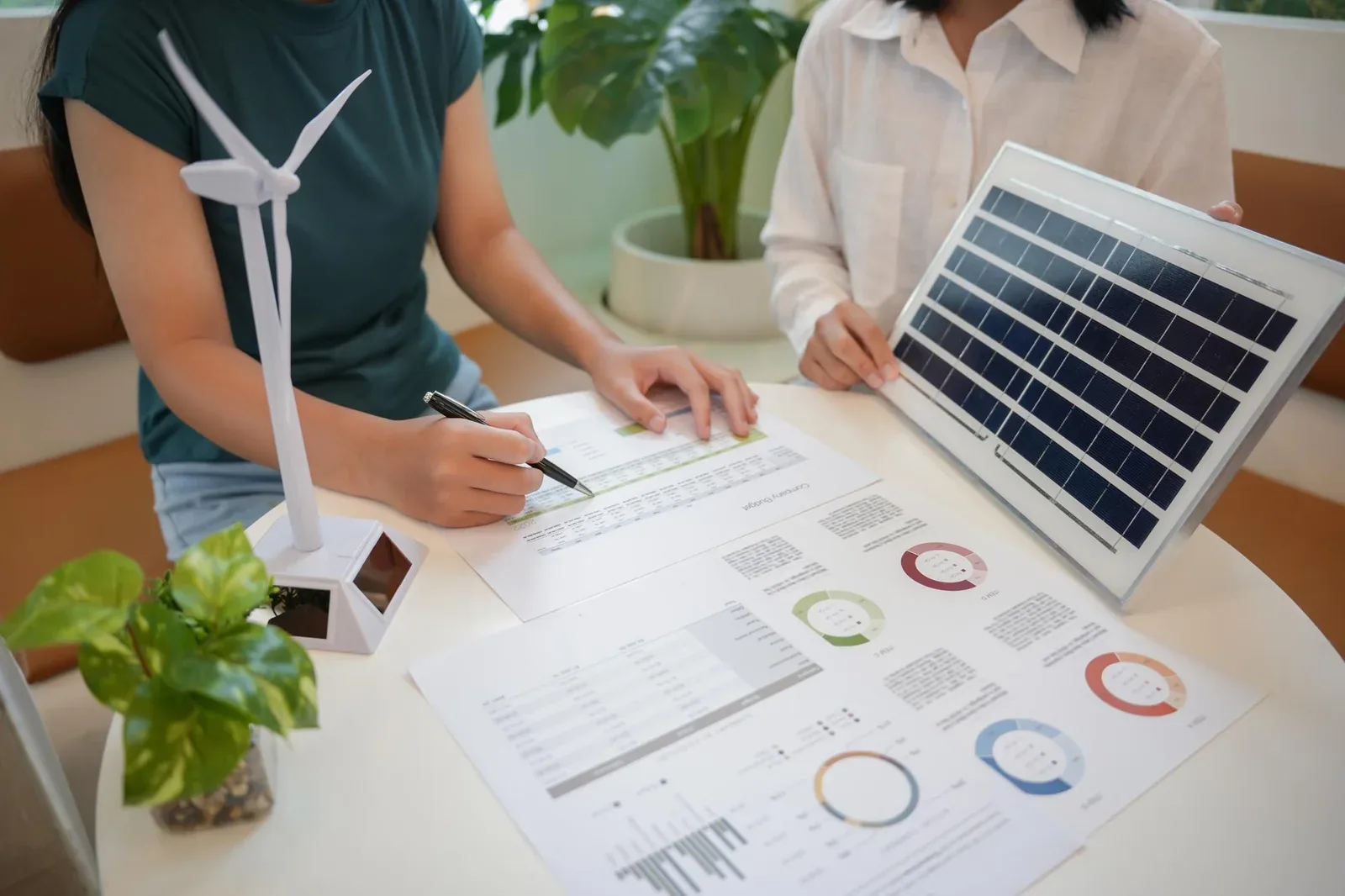 Energy assessor reviewing performance charts with a homeowner
